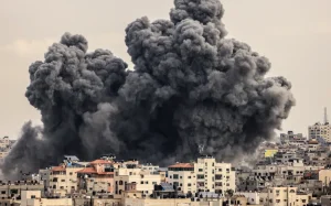 A plume of smoke rises in the sky of Gaza City during an Israeli airstrike on 9 October. Photo: AFP
