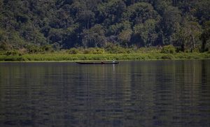 Two Lindu people fish on Lake Lindu in Sigi regency, Central Sulawesi, Indonesia, June 22, 2023.
